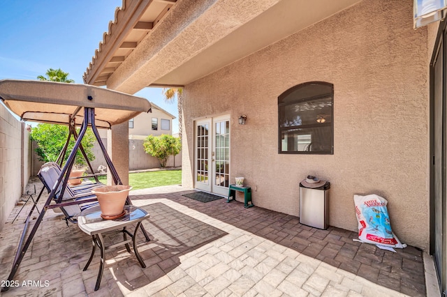 view of patio / terrace with french doors and a fenced backyard