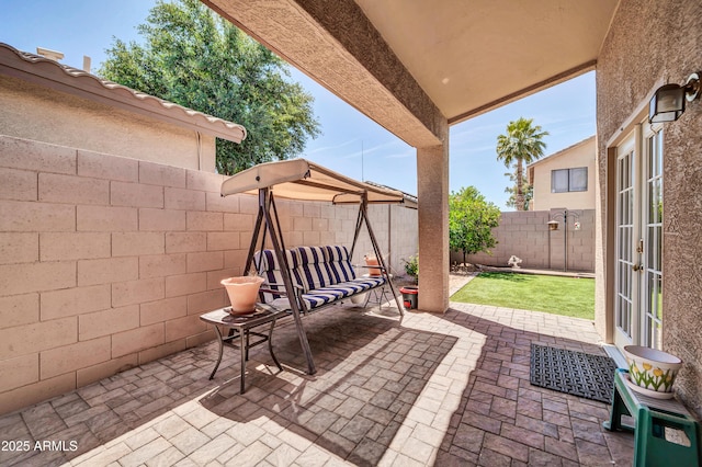 view of patio / terrace featuring french doors and a fenced backyard