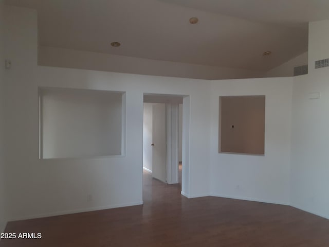 12205 N 41st Ln, Phoenix, AZ 85029 - unfurnished room featuring wood finished floors and lofted ceiling