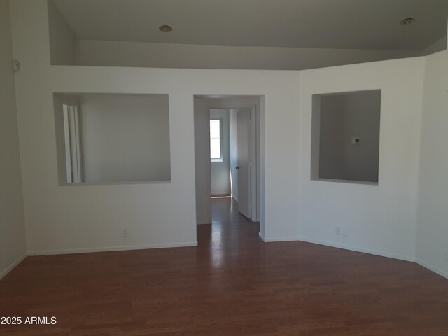 12205 N 41st Ln, Phoenix, AZ 85029 - empty room with dark wood-style flooring and baseboards