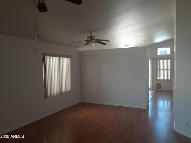 12205 N 41st Ln, Phoenix, AZ 85029 - unfurnished room featuring a ceiling fan, wood finished floors, and vaulted ceiling