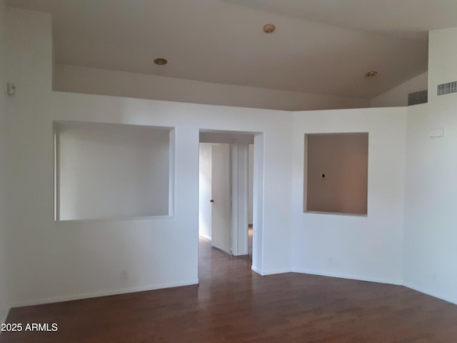 12205 N 41st Ln, Phoenix, AZ 85029 - unfurnished room featuring dark wood-style flooring and vaulted ceiling