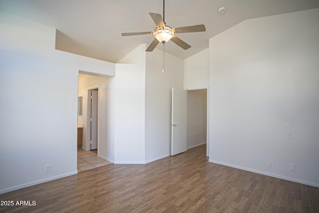 12205 N 41st Ln, Phoenix, AZ 85029 - unfurnished room with ceiling fan, wood finished floors, a smoke detector, and high vaulted ceiling
