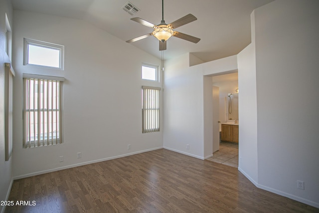 12205 N 41st Ln, Phoenix, AZ 85029 - spare room featuring ceiling fan, wood finished floors, and high vaulted ceiling
