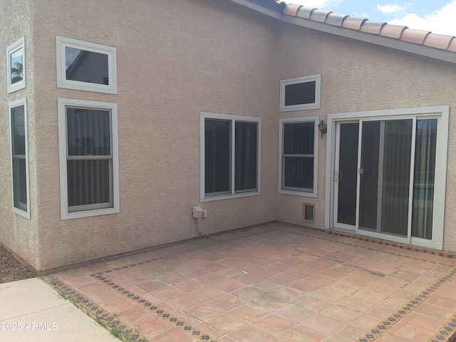 12205 N 41st Ln, Phoenix, AZ 85029 - rear view of property featuring stucco siding and a patio area