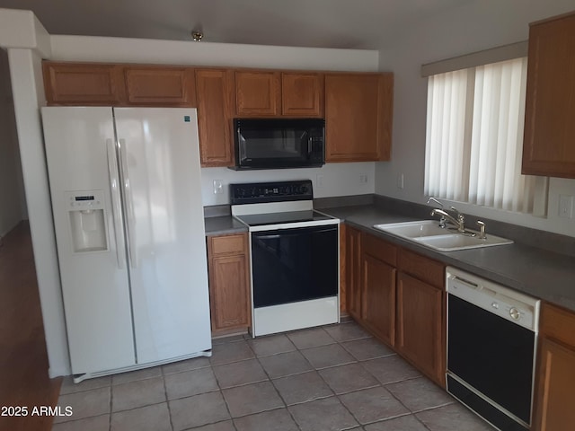 12205 N 41st Ln, Phoenix, AZ 85029 - kitchen with black microwave, white fridge with ice dispenser, electric stove, dishwashing machine, and light tile patterned flooring