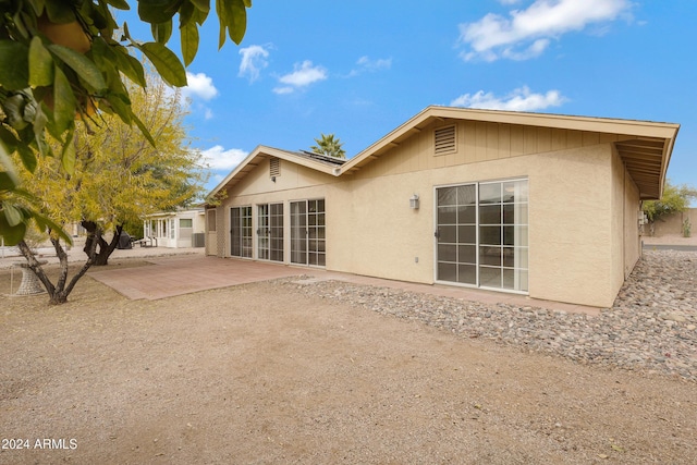 back of property featuring a patio area