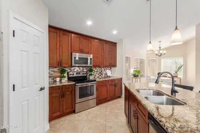 kitchen featuring light tile patterned floors, an inviting chandelier, a sink, stainless steel appliances, and tasteful backsplash