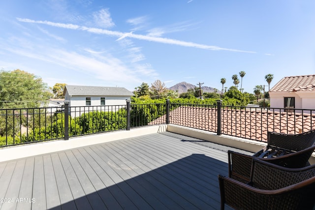 wooden deck with a mountain view