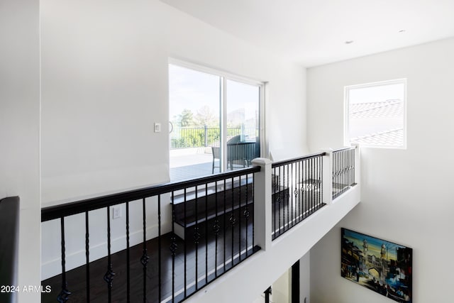 hallway with hardwood / wood-style flooring