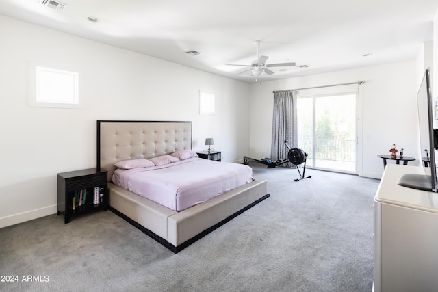 bedroom with access to outside, ceiling fan, and light colored carpet