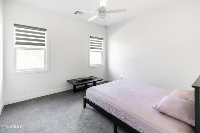 carpeted bedroom featuring ceiling fan