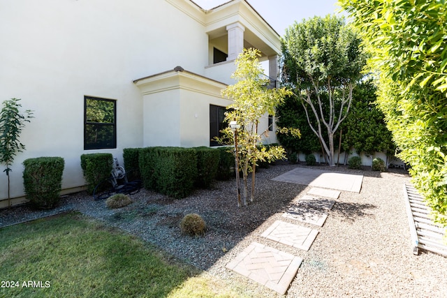 view of side of property featuring a patio area