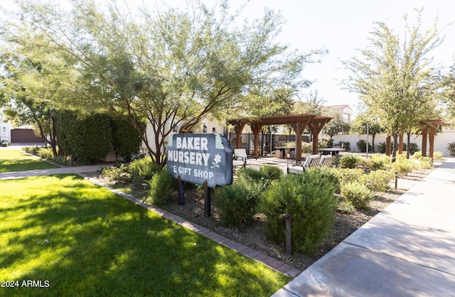 surrounding community with a pergola and a lawn