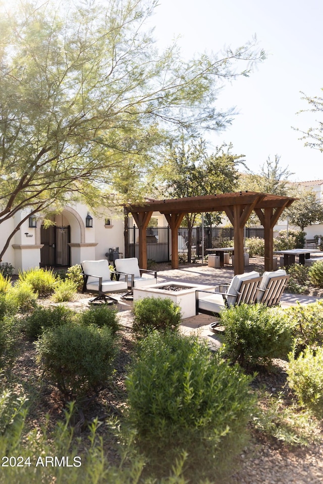 exterior space featuring a pergola, a hot tub, and a patio area