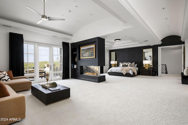 carpeted bedroom featuring access to outside, lofted ceiling, ceiling fan, and a multi sided fireplace