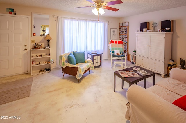 living room featuring a textured ceiling and ceiling fan