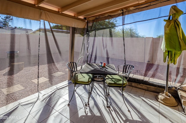 unfurnished sunroom featuring plenty of natural light