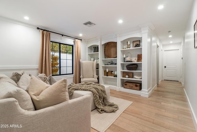 sitting room featuring light hardwood / wood-style floors