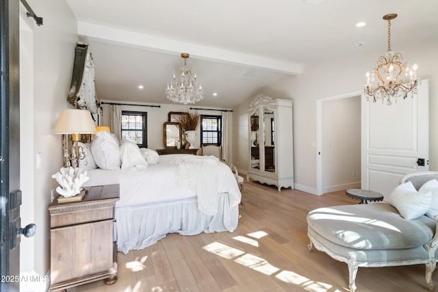 bedroom featuring lofted ceiling with beams, a chandelier, and light hardwood / wood-style flooring