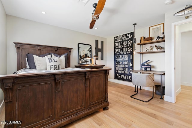 bedroom with ceiling fan and light wood-type flooring