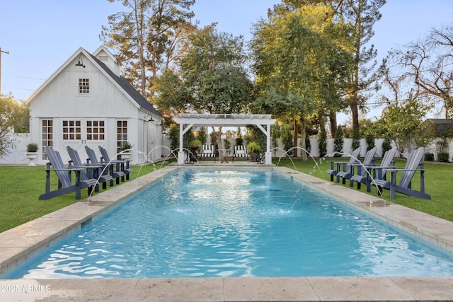 view of swimming pool with pool water feature, a yard, an outdoor structure, and a pergola