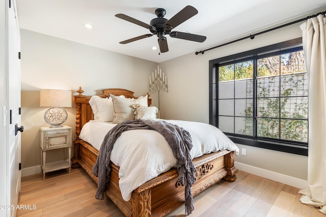 bedroom featuring ceiling fan and light hardwood / wood-style floors