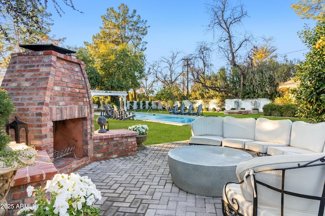 view of patio / terrace featuring an outdoor living space with a fireplace