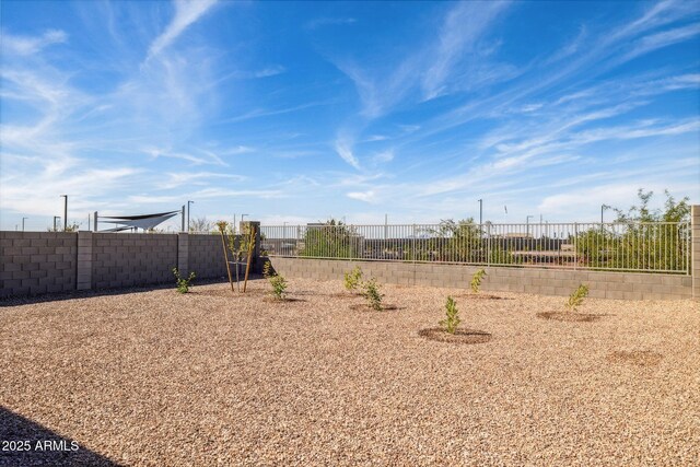 view of yard with a fenced backyard