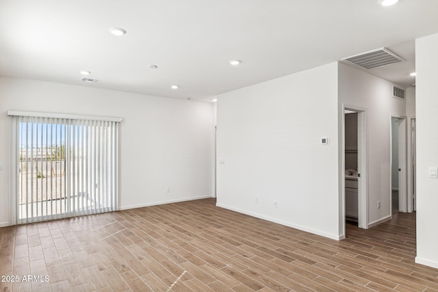 empty room with recessed lighting, visible vents, and light wood-style flooring