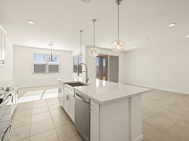 kitchen with white cabinets, dishwasher, an island with sink, pendant lighting, and sink