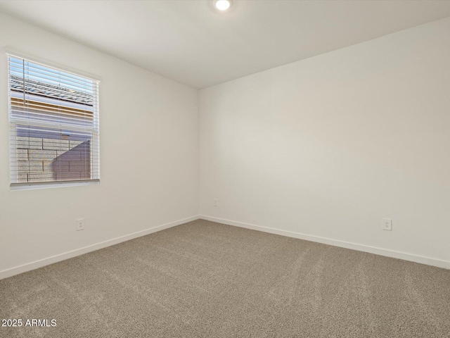 unfurnished room featuring carpet