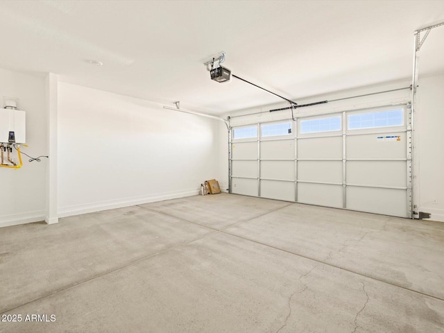 garage featuring tankless water heater and a garage door opener