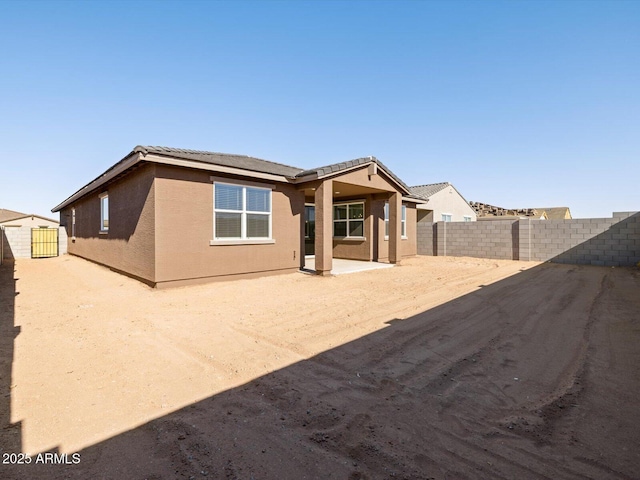 back of house with a patio area