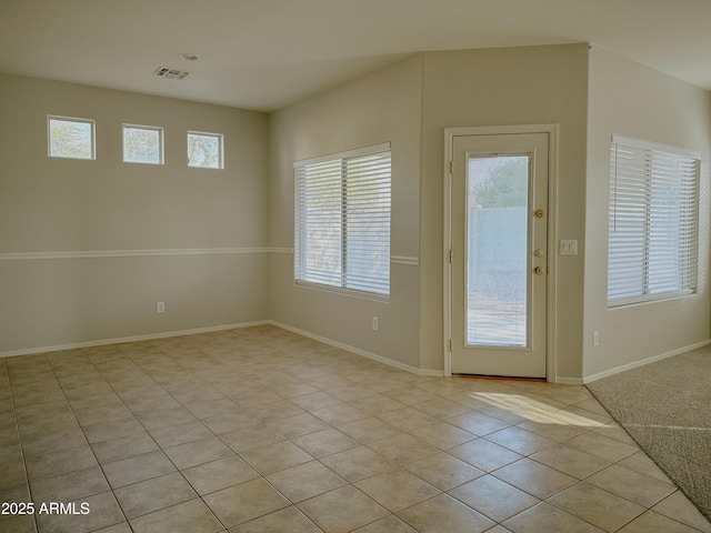 doorway to outside featuring light tile patterned floors and plenty of natural light