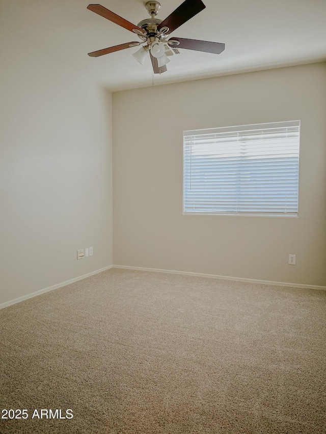 carpeted empty room featuring ceiling fan