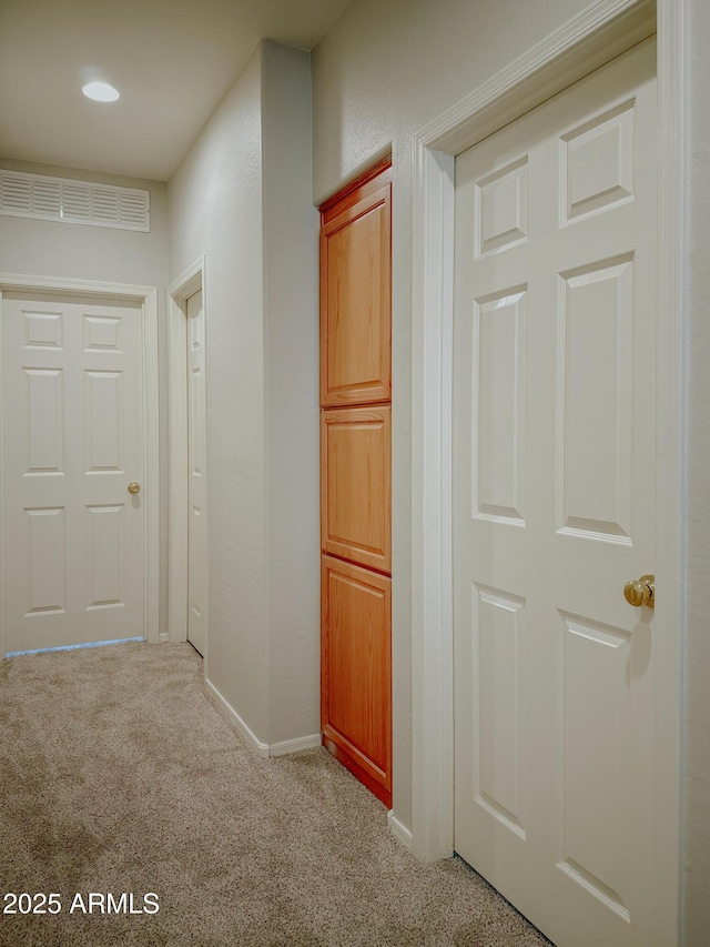 hallway with light carpet