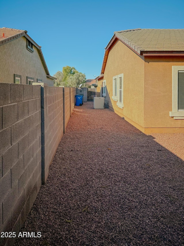 view of yard featuring central air condition unit