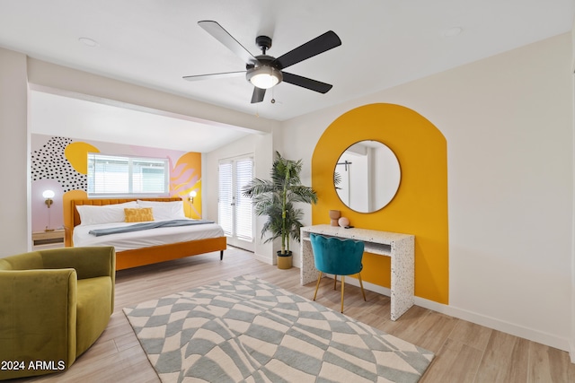 bedroom with light hardwood / wood-style flooring and ceiling fan