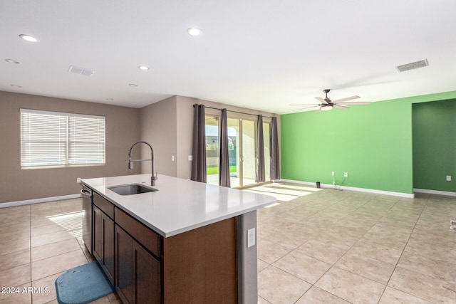 kitchen with ceiling fan, a wealth of natural light, dishwasher, and sink