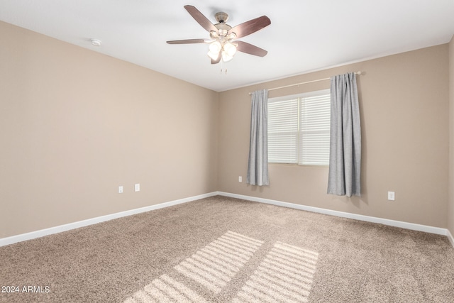 unfurnished room with light carpet and ceiling fan