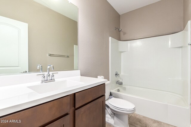 full bathroom featuring tile patterned flooring, toilet, shower / bathing tub combination, and vanity