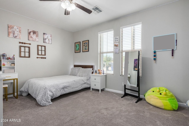 bedroom featuring carpet, baseboards, and a ceiling fan