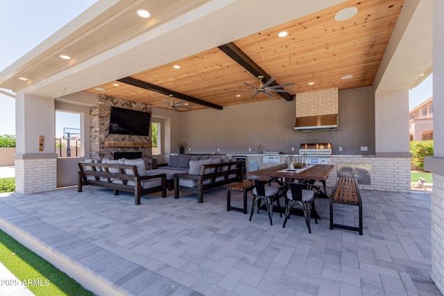 view of patio / terrace with area for grilling, an outdoor living space with a fireplace, ceiling fan, outdoor dining space, and grilling area