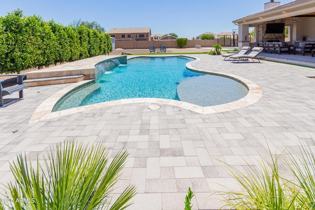 view of pool with a patio area, a fenced backyard, and an outdoor living space