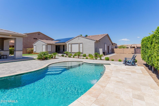 view of pool featuring a patio area and a fenced backyard