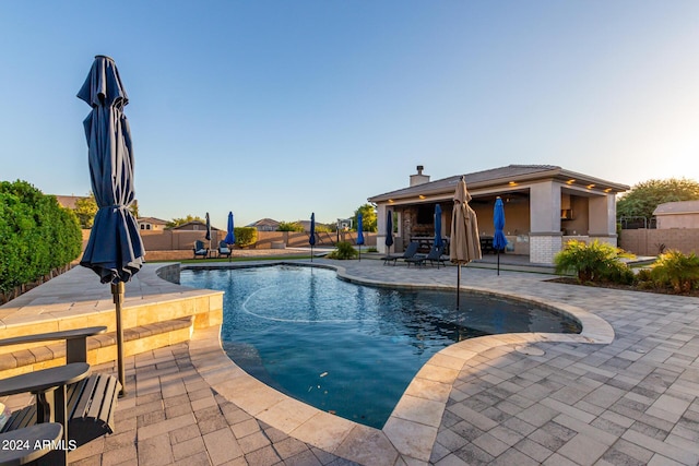 view of pool featuring a patio area and fence