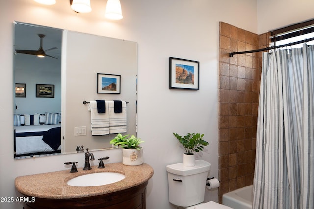 bathroom with shower / tub combo, vanity, and toilet