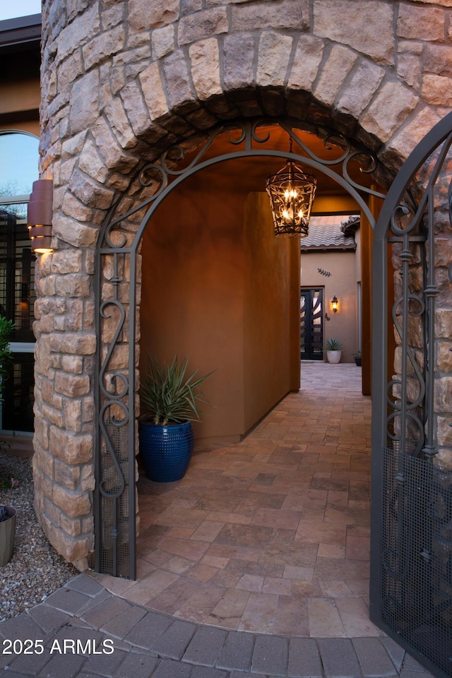 doorway to property with stone siding