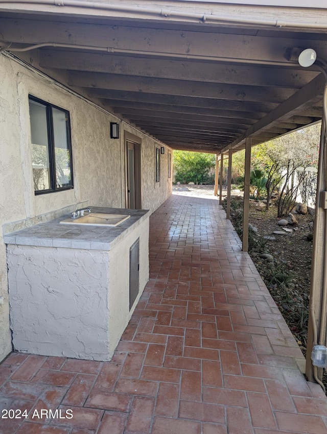 view of patio / terrace with sink and an outdoor kitchen